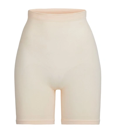 Shop Skims Mid-thigh Sculpting Shorts In Nude