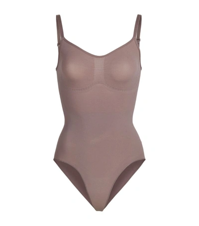 Shop Skims Sculpting Bodysuit In Brown