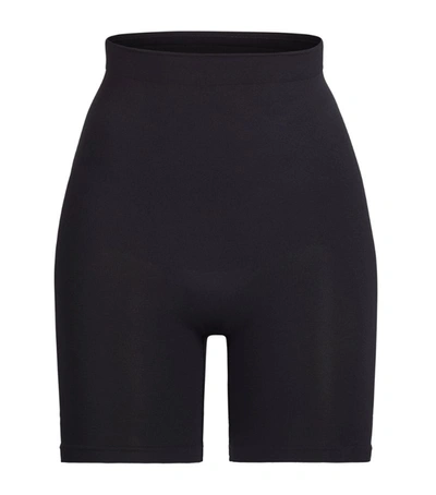 Shop Skims Seamless Sculpt Mid-thigh Shorts In Black