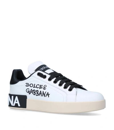 Shop Dolce & Gabbana Portofino Script Sneakers In White