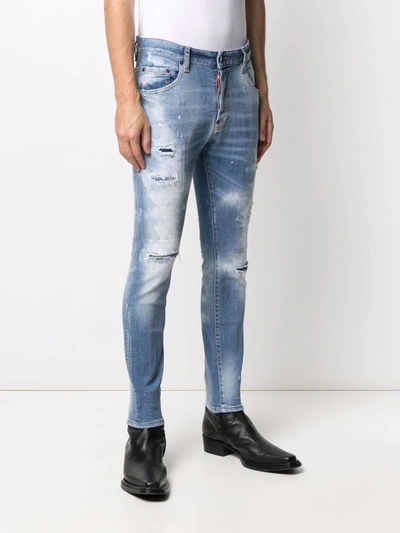 Shop Dsquared2 Paint-splatter Ripped Skinny Jeans In Blue