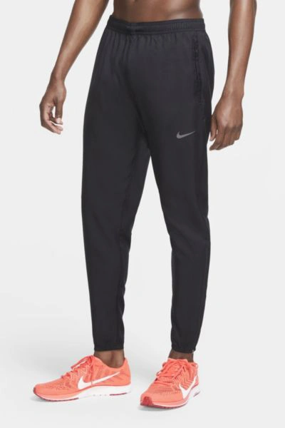 Shop Nike Essential Woven Pant In Black