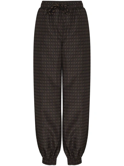 Shop Fendi Ff Printed Track Pants In Brown