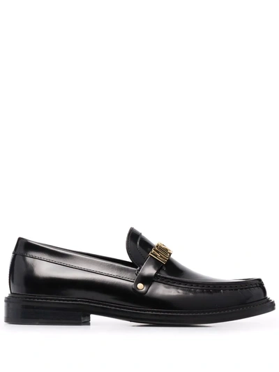 Shop Moschino Logo Lettered Almond Toe Loafers In Schwarz