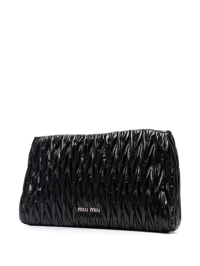 Shop Miu Miu Matelassé-effect Clutch Bag In Pink