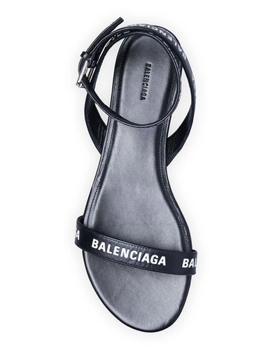 Shop Balenciaga Logo Ankle-strap Flat Sandals In Black