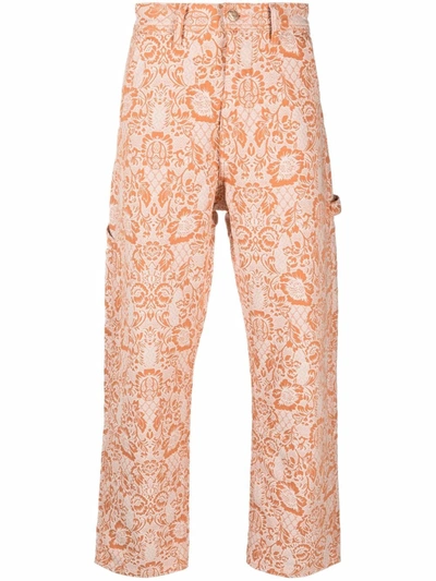 Shop Aries 1991 Carpenter Paisley-print Trousers In Orange