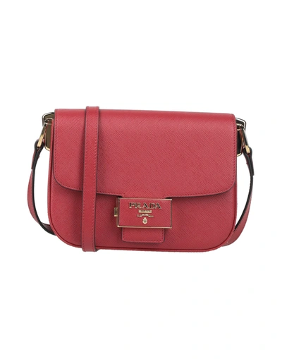 Shop Prada Handbags In Red