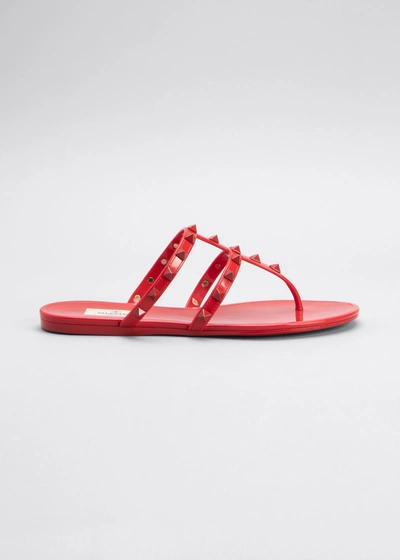 Shop Valentino Jelly Rockstud Flat Thong Sandals In 0ro Rosso V