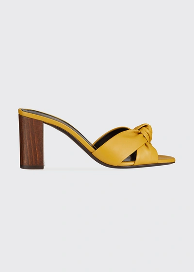 Shop Saint Laurent Bianca Knotted Napa Slide Heel Sandals In Yellow