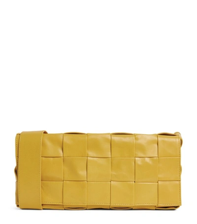 Shop Bottega Veneta Leather Intreccio Stretch Cassette Cross-body Bag In Yellow