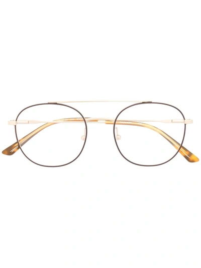 Shop Calvin Klein Round-frame Glasses In Gold