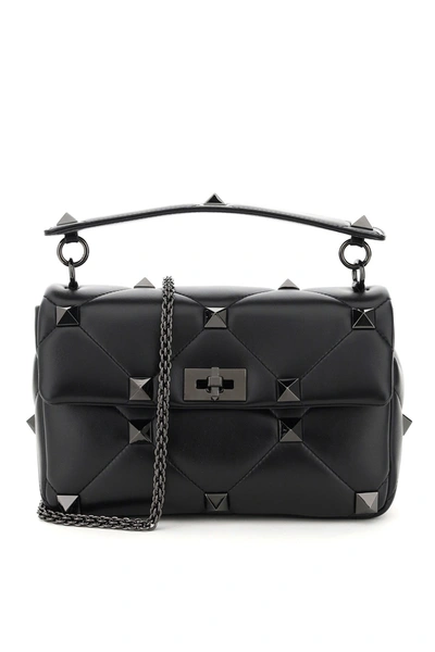 Shop Valentino Garavani Roman Stud Shoulder Bag In Black