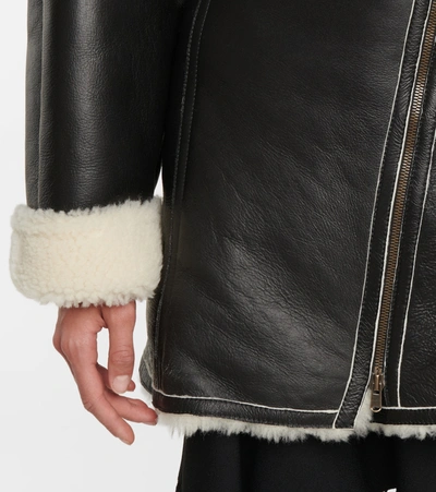 Shop Alaïa Edition 1987 Shearling And Leather Coat In Black