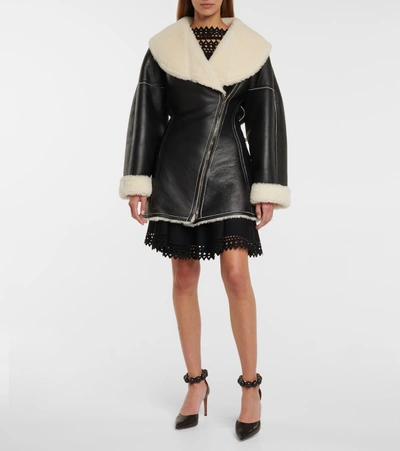 Shop Alaïa Edition 1987 Shearling And Leather Coat In Black