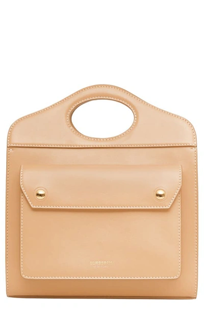 Shop Burberry Mini Leather Pocket Bag In Warm Sand