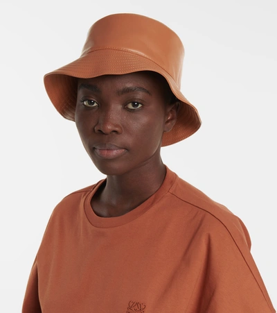 Shop Loewe Anagram Leather Bucket Hat In Brown