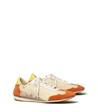 Shop Tory Burch Tory Sneaker, Extended Width In New Ivory / Rust