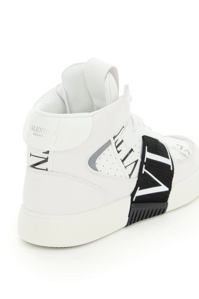 Shop Valentino Vl7n Mid-top Sneakers In White,black