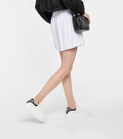 Shop Prada Macro Leather Sneakers In White