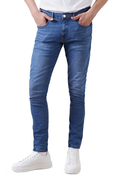 Shop River Island Eddy Lebron Skinny Jeans In Mid Blue
