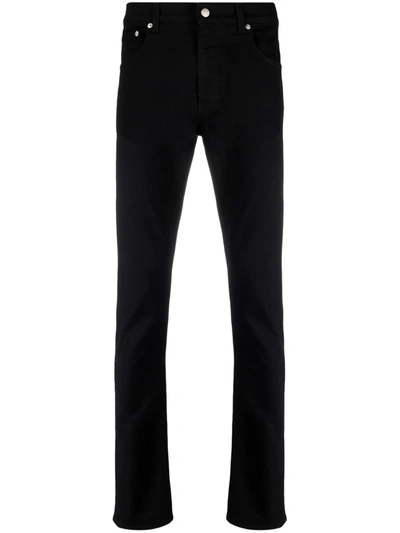 Shop Alexander Mcqueen Logo-patch Slim-cut Trousers In 黑色