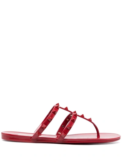 Shop Valentino Rockstud Thong Sandals In Rot