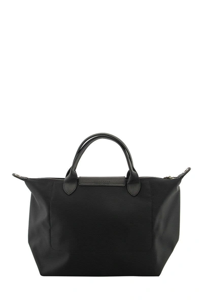 Shop Longchamp Le Pliage Néo - Top Handle Bag M In Black