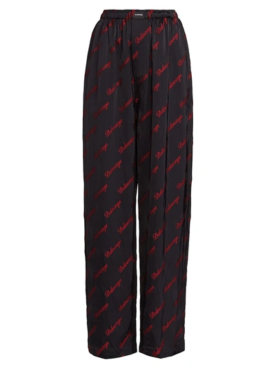 Shop Balenciaga Allover Logo Pajama Pants In Black Red