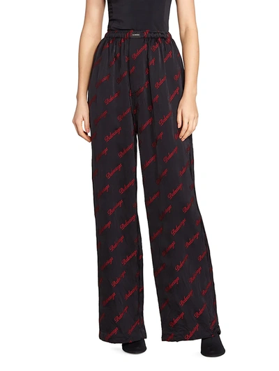 Shop Balenciaga Allover Logo Pajama Pants In Black Red