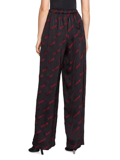 Shop Balenciaga Allover Logo Pajama Pants In Black Red