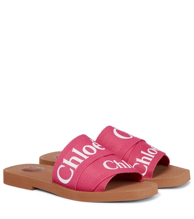 Shop Chloé Woody Canvas Slides In Pink