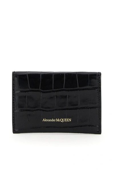 Shop Alexander Mcqueen Skull Embossed Wallet In Black