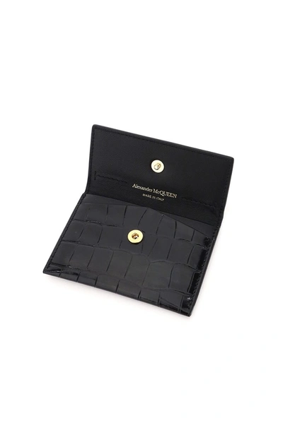 Shop Alexander Mcqueen Skull Embossed Wallet In Black