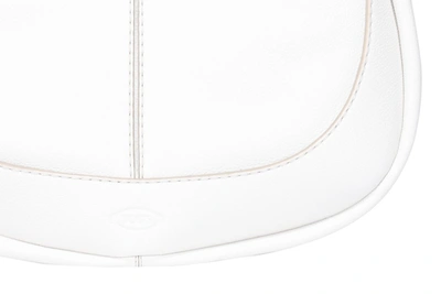 Shop Tod's Logo Embossed Hobo Bag In White
