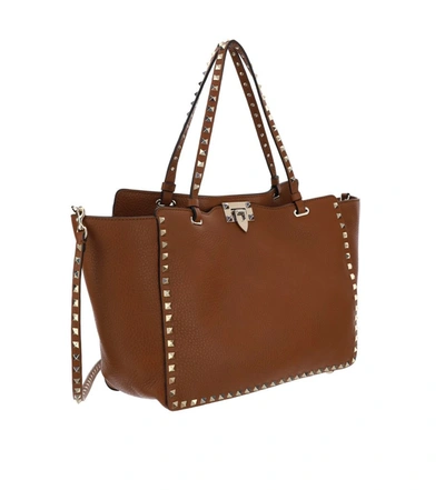 Shop Valentino Garavani Rockstud Embellished Tote Bag In Brown