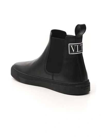 Shop Valentino Vltn Beatle Ankle Boots In Black