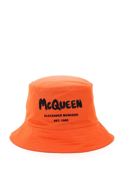 Shop Alexander Mcqueen Graffiti Logo Print Bucket Hat In Orange