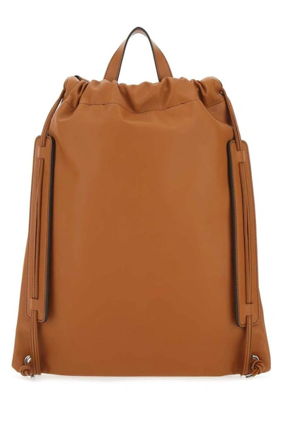 Shop Fendi Logo Embossed Top Handle Backpack In Brown