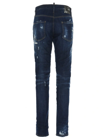 Shop Dsquared2 Distressed Paint Effect Jeans In Blue
