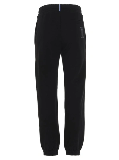 Shop Mcq By Alexander Mcqueen Mcq Alexander Mcqueen Back Logo Patch Tapered Pants In Black