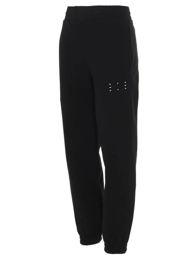 Shop Mcq By Alexander Mcqueen Mcq Alexander Mcqueen Back Logo Patch Tapered Pants In Black