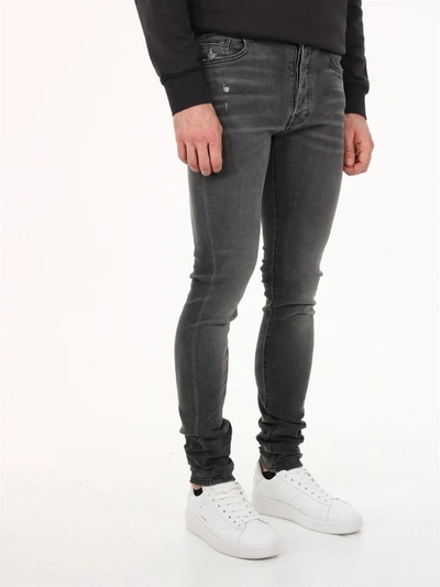 Shop Amiri Distressed Slim Jeans In Grey