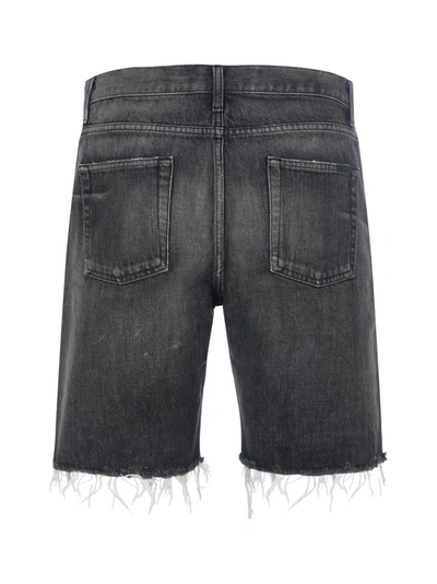 Shop Saint Laurent Frayed Hem Denim Shorts In Black