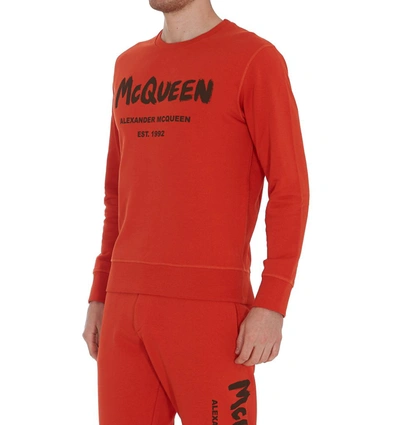 Shop Alexander Mcqueen Graffiti Logo Print Sweatshirt In Orange