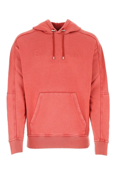 Shop Balmain Logo Embossed Hoodie In Red