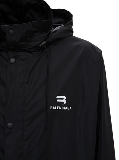 Shop Balenciaga Logo Printed Hooded Raincoat In Black