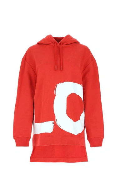 Shop Burberry Love Print Oversized Hoodie In Red