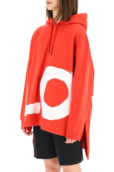 Shop Burberry Love Print Oversized Hoodie In Red