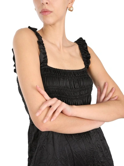 Shop Ganni Crinkled Stain Sleeveless Jumpsuit In Black
